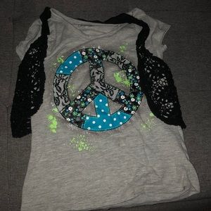 A girls shirt with sewed in vest